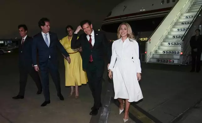 U.S. Secretary of State Marco Rubio, second right, and his wife Jeanette Rubio, right, deplane at a military base in Lima, Peru, Wednesday, Sept. 9, 2026. (AP Photo/Martin Mejia, Pool)