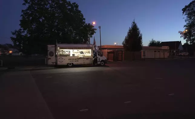 Martial Realland's food truck in Saint-Just-en-Chaussee, France, Wednesday Sept. 23, 2026. (AP Photo/John Leicester)
