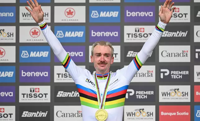 Brandon McNulty, of the United States, celebrates after winning the men's elite road race at the UCI Road World Championships cycling event in Montreal on Sunday, Sept. 27, 2026. (Graham Hughes/The Canadian Press via AP)