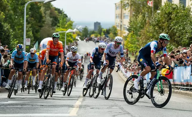 Brandon McNulty, of the United States, second right, races in the peloton during the men's elite road race at the UCI Road World Championships cycling event in Montreal, on Sunday, Sept. 27, 2026. (Christopher Katsarov/The Canadian Press via AP)