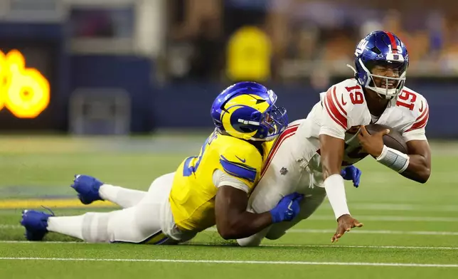 New York Giants quarterback Jameis Winston (19) is sacked by Los Angeles Rams linebacker Byron Young during the second half of an NFL football game in Inglewood, Calif., Monday, Sept. 21, 2026. (AP Photo/Caroline Brehman)