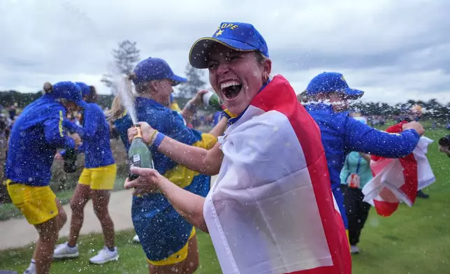 Mimi Rhodes of Europe celebrates with teammates after they won the Solheim Cup on the final day in Den Bosch, Netherlands, Sunday, Sept. 13, 2026. (AP Photo/Alastair Grant)