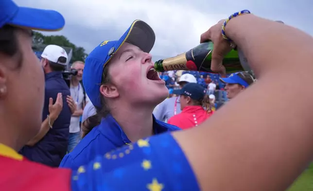 Lottie Woad of Europe of Europe celebrates with teammates after they won the Solheim Cup on the final day in Den Bosch, Netherlands, Sunday, Sept. 13, 2026. (AP Photo/Alastair Grant)