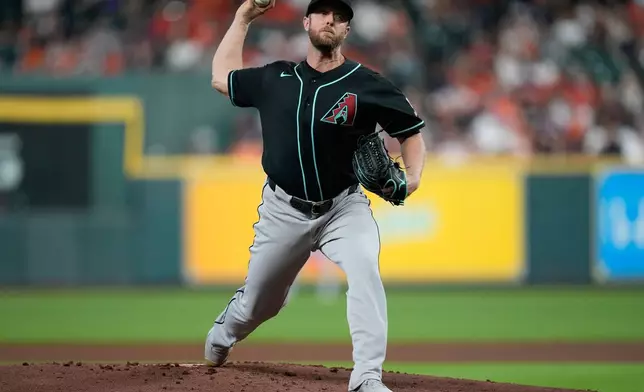 Arizona Diamondbacks starting pitcher Merrill Kelly throws during the first inning of a baseball game against the Houston Astros in Houston, Friday, Sept. 4, 2026. (AP Photo/Ashley Landis)