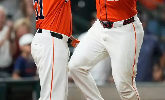 Houston Astros' Yainer Diaz, right, celebrates with LaMonte Wade Jr. (31) after hitting a home run during the third inning of a baseball game against the Arizona Diamondbacks in Houston, Friday, Sept. 4, 2026. (AP Photo/Ashley Landis)