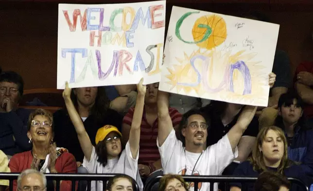 FILE - Fans show their support for the return to Connecticut of Diana Taurasi as well as the Connecticut Sun, during WNBA basketball team's home opener in Uncasville, Conn., Saturday, May 22, 2004. (AP Photo/John Spivey, File)