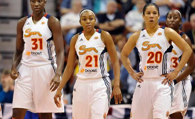 FILE - Connecticut Sun's Tina Charles (31), Renee Montgomery (21) and Kara Lawson (20) return to the court after a timeout in the second half of Game 3 of the WNBA basketball Eastern Conference finals against the Indiana Fever in Uncasville, Conn., Thursday, Oct. 11, 2012. (AP Photo/Jessica Hill, File)