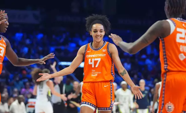 FILE - Connecticut Sun guard Leila Lacan (47) celebrates a play with teammates during the second half of a WNBA basketball game against the Dallas Wings in Arlington, Texas, Wednesday, Aug. 27, 2025. (AP Photo/LM Otero, File)