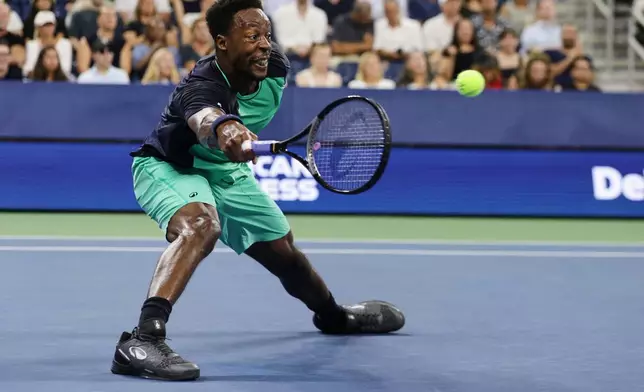 Gael Monfils, of France, reaches to hit a return to Adolfo Daniel Vallejo, of Paraguay, during the first round of the U.S. Open tennis championships Tuesday, Sept. 1, 2026, in New York. (AP Photo/Adam Hunger)