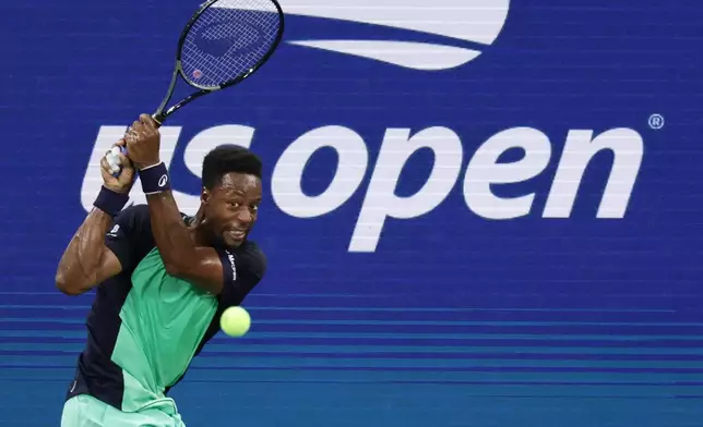 Gael Monfils, of France, hits a return to Learner Tien, of the United States, during the second round of the U.S. Open tennis championships, Thursday, Sept. 3, 2026, in New York. (AP Photo/Adam Hunger)