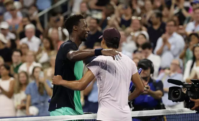 Gael Monfils, left, of France, embraces Learner Tien, of the United States, after their match in the second round of the U.S. Open tennis championships, Thursday, Sept. 3, 2026, in New York. (AP Photo/Adam Hunger)