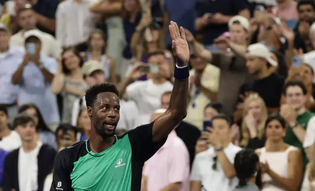 Gael Monfils, of France, acknowledges fans after losing to Learner Tien, of the United States, during the second round of the U.S. Open tennis championships, Thursday, Sept. 3, 2026, in New York. (AP Photo/Adam Hunger)