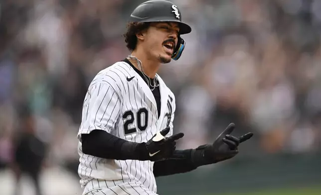 Chicago White Sox's Miguel Vargas celebrates while rounding first base after hitting a solo home run during the sixth inning of a baseball game against the Detroit Tigers Saturday, Sept. 19, 2026, in Chicago. (AP Photo/Paul Beaty)