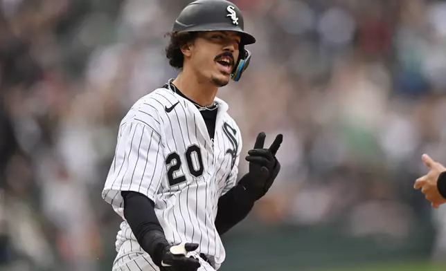 Chicago White Sox's Miguel Vargas celebrates while rounding first base after hitting a solo home run during the sixth inning of a baseball game against the Detroit Tigers Saturday, Sept. 19, 2026, in Chicago. (AP Photo/Paul Beaty)