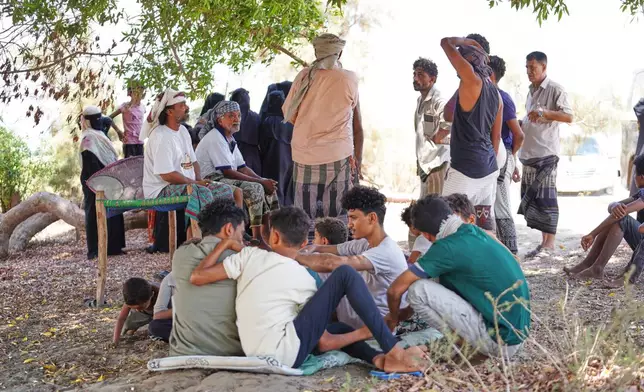 Displaced Yemenis, from Al Khawkhah city, 400 kilometers (249 miles) south west of Sanaa, wait to enter a temporary shelter in Aden, Yemen, Sunday, Sept. 13, 2026. (AP Photo/Abdulnasser Alseddik)