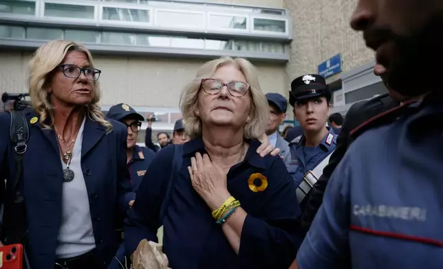 Paola Deffendi, Giulio Regeni's mother, center, reacts with emotion as she leaves a courtroom after three of four Egyptian security officials were convicted to 10 years in prison for the abduction and murder of her son in Cairo in 2016, in Rome, Monday, Sept. 28, 2026. (Cecilia Fabiano/LaPresse via AP)