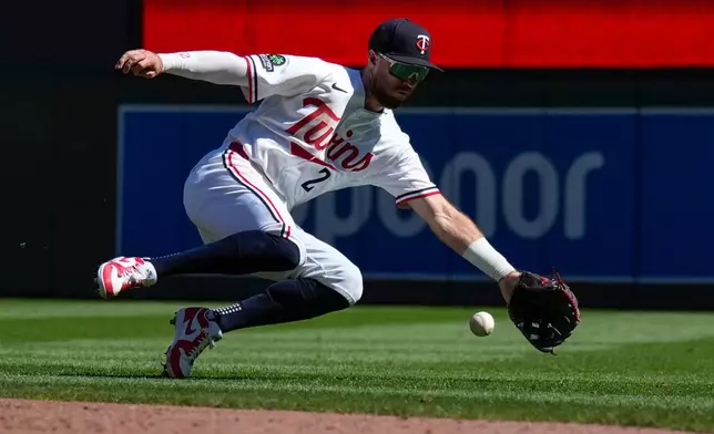 Minnesota Twins second baseman Kody Clemens fields a single hit by Cleveland Guardians' Steven Kwan during the second inning of a baseball game Sunday, Sept. 13, 2026, in Minneapolis. (AP Photo/Joseph Scheller)
