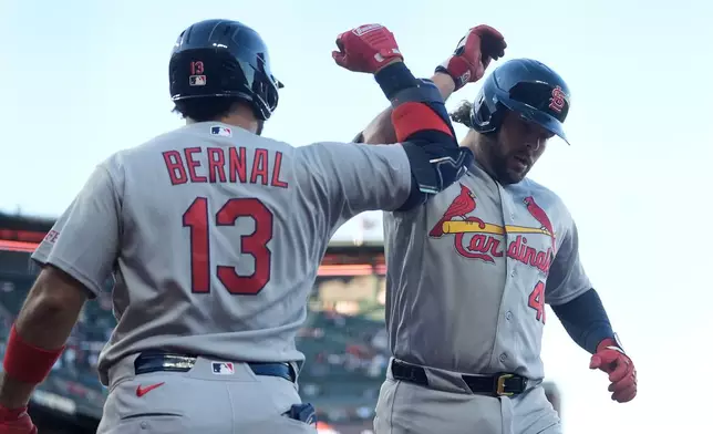 St. Louis Cardinals' Alec Burleson, right, is congratulated by Leo Bernal (13) after hitting a home run against the San Francisco Giants during the sixth inning of a baseball game, Monday, Sept. 7, 2026, in San Francisco. (AP Photo/Jeff Chiu)