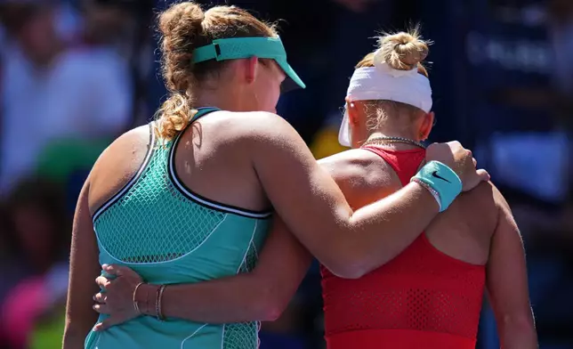 Mirra Andreeva, of Russia, left, hugs Anastasia Potapova, of Austria, after winning a match during the fourth round of the U.S. Open tennis championships, Monday, Sept. 7, 2026, in New York. (AP Photo/Kirsty Wigglesworth)
