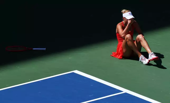 Anastasia Potapova, of Austria, reacts after falling on the court during a match against Mirra Andreeva, of Russia, during the fourth round of the U.S. Open tennis championships, Monday, Sept. 7, 2026, in New York. (AP Photo/Andres Kudacki)