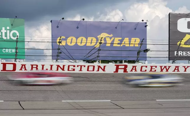 Drivers compete through Turn 2 during a NASCAR Cup Series auto race at Darlington Raceway, Sunday, Sept. 6, 2026, in Darlington, S.C. (AP Photo/Matt Kelley)