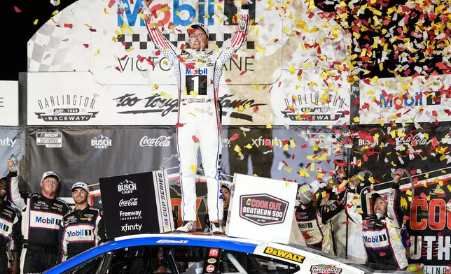 Christopher Bell celebrates in Victory Lane after winning a NASCAR Cup Series auto race Sunday, Sept. 6, 2026, in Darlington, S.C. (AP Photo/Matt Kelley)