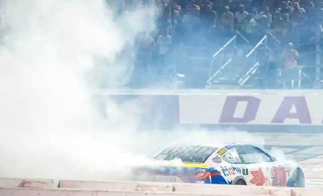 Christopher Bell does a burnout after winning a NASCAR Cup Series auto race Sunday, Sept. 6, 2026, in Darlington, S.C. (AP Photo/Matt Kelley)