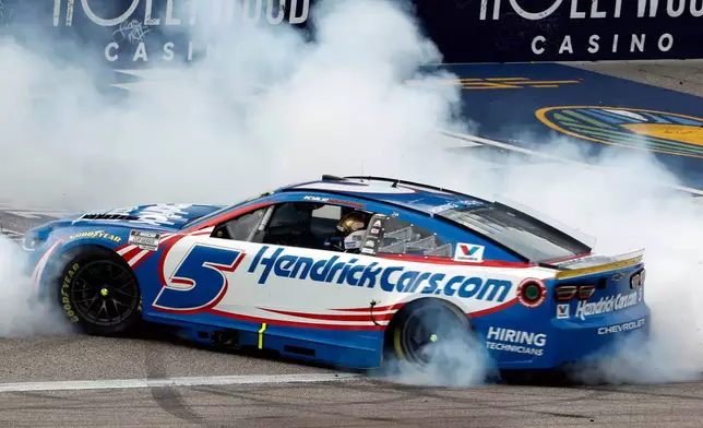Kyle Larson does a burnout after winning a NASCAR Cup Series auto race in Kansas City, Kan., Sunday, Sept. 27, 2026. (AP Photo/Colin E. Braley)