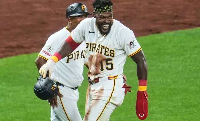 After stealing third base Pittsburgh Pirates' Oneil Cruz (15) takes his lead off during the eighth inning of a baseball game against the San Francisco Giants in Pittsburgh, Wednesday, Sept. 2, 2026. (AP Photo/Gene J. Puskar)