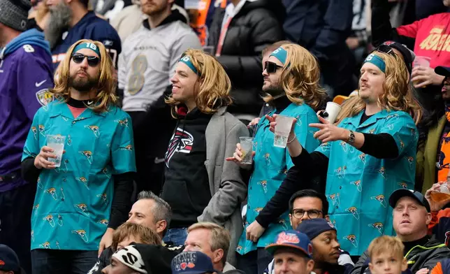 FILE - Fans sing during an NFL football game between the Jacksonville Jaguars and the Chicago Bears at Tottenham Hotspur Stadium, Oct. 13, 2024, in London. (AP Photo/Steve Luciano, File)