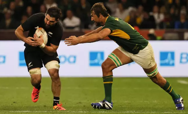 New Zealand's Luke Jacobson, left, is being challenged by South Africa's Eben Etzebeth during a second Test rugby match between South Africa and New Zealand, in Cape Town, South Africa, Saturday, Aug. 29, 2026. (AP Photo/Halden Krog)