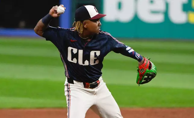 Cleveland Guardians' Jose Ramirez throws out Athletics' Jonah Heim at first base during the first inning of a baseball game, Friday, Sept. 18, 2026, in Cleveland. (AP Photo/Phil Long)