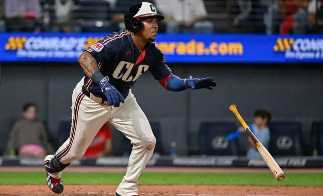 Cleveland Guardians' Jose Ramirez watches his RBI single off Athletics starting pitcher Mason Barnett during the fourth inning of a baseball game, Friday, Sept. 18, 2026, in Cleveland. (AP Photo/Phil Long)