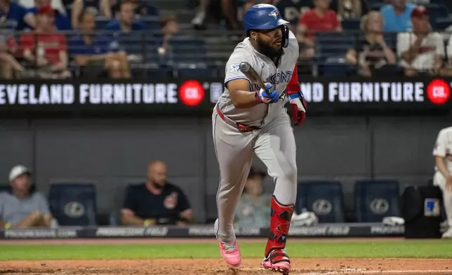 Toronto Blue Jays' Vladimir Guerrero Jr. watches his RBI single off Cleveland Guardians relief pitcher Carlos Hernandez during the sixth inning of a baseball game, Wednesday, Sep. 2, 2026, in Cleveland. (AP Photo/Phil Long)