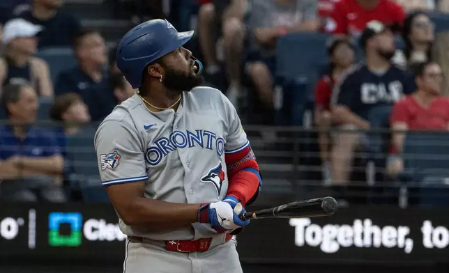 Toronto Blue Jays' Vladimir Guerrero Jr. watches his three-run home run off Cleveland Guardians starting pitcher Joey Cantillo during the second inning of a baseball game, Wednesday, Sep. 2, 2026, in Cleveland. (AP Photo/Phil Long)