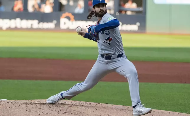 Toronto Blue Jays starting pitcher Dylan Cease delivers against the Cleveland Guardians during the first inning of a baseball game, Wednesday, Sep. 2, 2026, in Cleveland. (AP Photo/Phil Long)