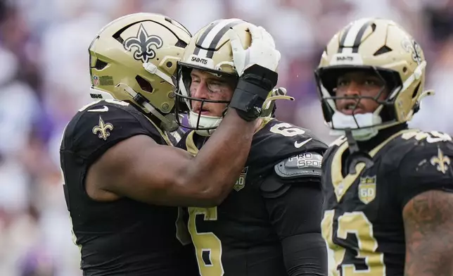New Orleans Saints quarterback Tyler Shough (6) reacts after scoring the winning touchdown on fourth down in the second half of an NFL football game against the Baltimore Ravens in Baltimore, Sunday, Sept. 20, 2026. (AP Photo/Stephanie Scarbrough)