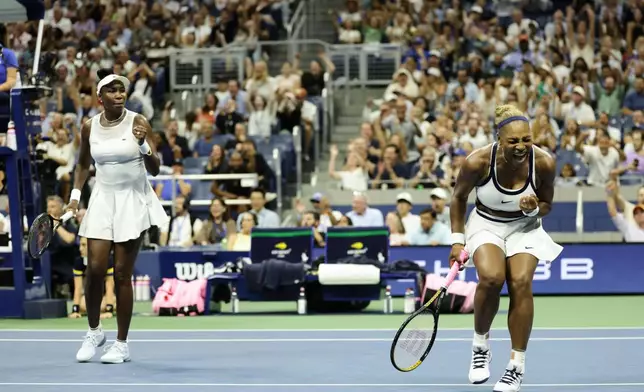 Serena Williams, right, and Venus Williams, of the United States, celebrates after a point against Hao-Ching Chan, of Taiwan, and Maya Joint, at the U.S. Open tennis championships, Friday, Sept. 4, 2026, in New York. (AP Photo/Adam Hunger)