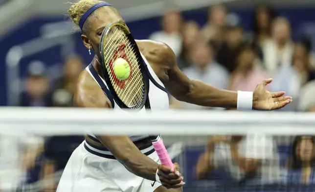 Serena Williams, of the United States, hits a return as she plays a women's doubles match with partner Venus Williams against Hao-Ching Chan, of Taiwan, and Maya Joint, at the U.S. Open tennis championships, Friday, Sept. 4, 2026, in New York. (AP Photo/Adam Hunger)