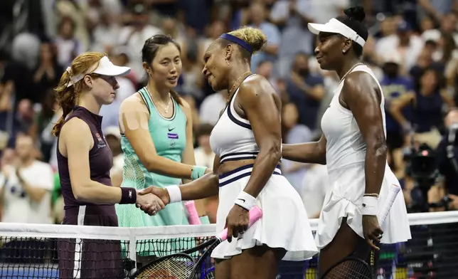 Venus, right, and Serena Williams, of the United States, congratulate Maya Joint, left, of Australia, and Hao-Ching Chan, of Taiwan, after their women's doubles match at the U.S. Open tennis championships, Friday, Sept. 4, 2026, in New York. (AP Photo/Adam Hunger)