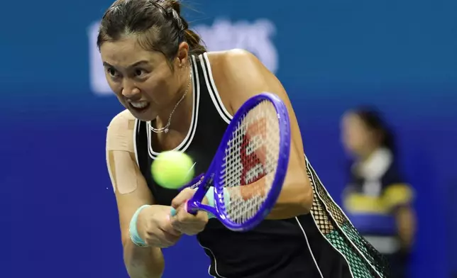 Hao-Ching Chan, of Taiwan, hits a return as she plays a women's doubles match with partner Maya Joint, of Australia, against Venus Williams and Serena Williams, of the United States at the U.S. Open tennis championships, Friday, Sept. 4, 2026, in New York. (AP Photo/Adam Hunger)