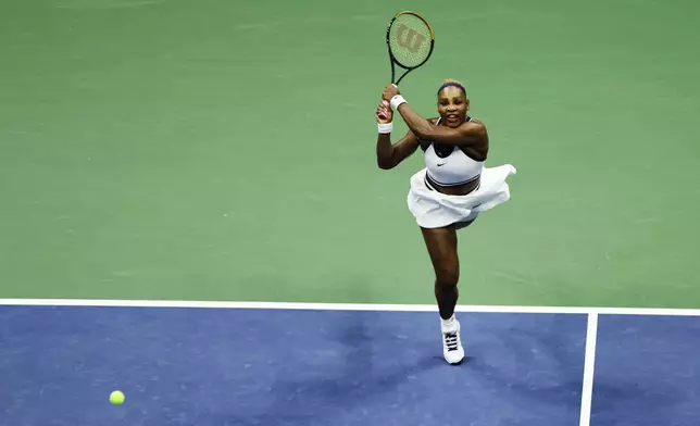 Serena Williams, of the United States, hits a return as she plays a women's doubles match with partner Venus Williams against Hao-Ching Chan, of Taiwan, and Maya Joint, at the U.S. Open tennis championships, Friday, Sept. 4, 2026, in New York. (AP Photo/Adam Hunger)