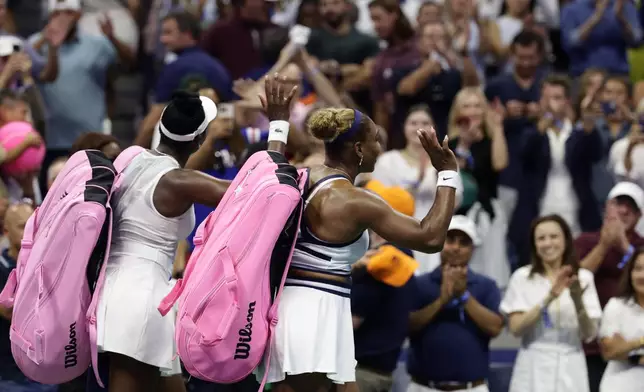 Venus, left, and Serena Williams, of the United States, acknowledge the fans after losing a women's doubles match against Hao-Ching Chan, of Taiwan, and Maya Joint, at the U.S. Open tennis championships, Friday, Sept. 4, 2026, in New York. (AP Photo/Adam Hunger)