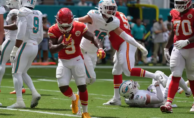 Kansas City Chiefs running back Kenneth Walker III scores a touchdown during an NFL football game against the Miami Dolphins, Sunday, Sept. 27, 2026, in Miami Gardens. (AP Photo/Lynne Sladky)