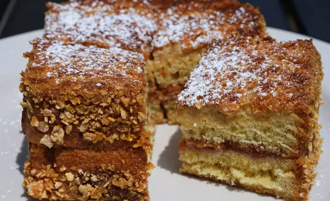 A griddled peanut butter and jelly sandwich, made with sourdough bread that is crusted in Frosted Flakes, appears at South Philadelphia Tap Room's in Philadelphia, Wednesday, Aug. 12, 2026. (AP Photo/Matt Rourke)
