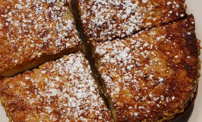 A griddled peanut butter and jelly sandwich, made with sourdough bread that is crusted in Frosted Flakes, appears at South Philadelphia Tap Room's in Philadelphia, Wednesday, Aug. 12, 2026. (AP Photo/Matt Rourke)