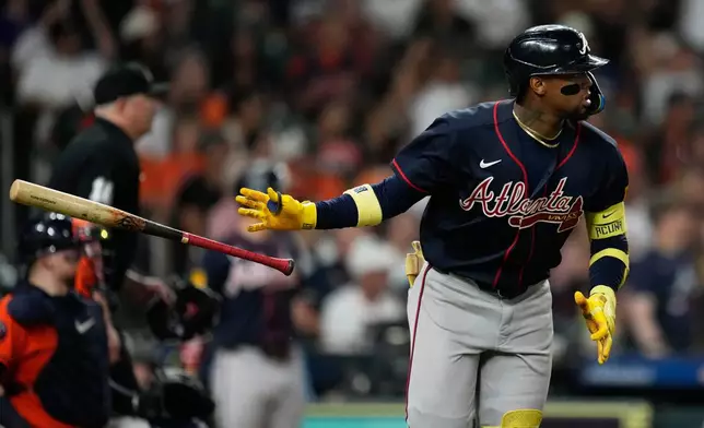 Atlanta Braves' Ronald Acuña Jr. tosses his bat after hitting a home run during the seventh inning of a baseball game against the Houston Astros in Houston, Friday, Sept. 18, 2026. (AP Photo/Ashley Landis)