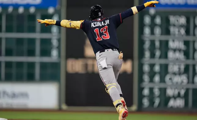 Atlanta Braves' Ronald Acuña Jr. celebrates after hitting a home run during the seventh inning of a baseball game against the Houston Astros in Houston, Friday, Sept. 18, 2026. (AP Photo/Ashley Landis)