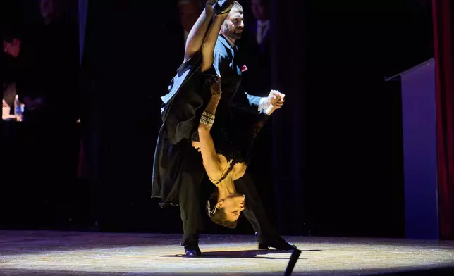 Dancers perform in a tango exhibition during the salon category competition at the Tango World Championship in Buenos Aires, Argentina, Tuesday, Sept. 1, 2026. (AP Photo/Rodrigo Abd)