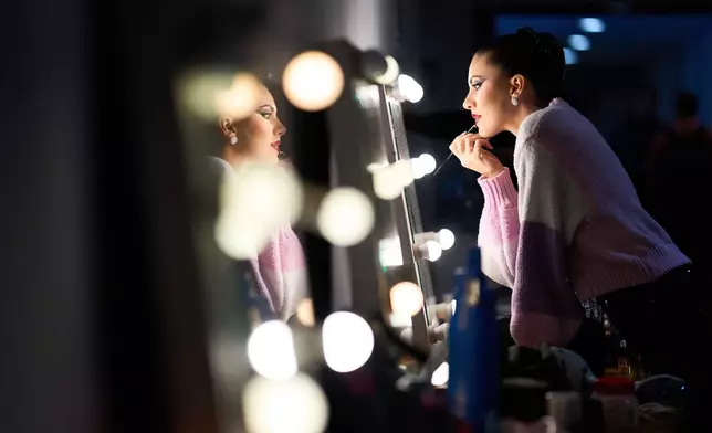 Chiara Benati of Italy applies makeup before her performance at the Tango World Championship in Buenos Aires, Argentina, Friday, Aug. 28, 2026. (AP Photo/Rodrigo Abd)